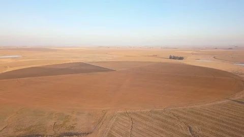 Fast flight over circular field in the dry season South Africa Video stock 79806777