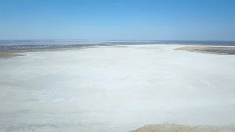 Fast flight over empty salt pan around Rakops in Botswana Stock Footage 80988067