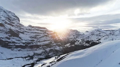 Fast flight over winter landscape with snowy mountains at sunrise Stock Footage 85218848