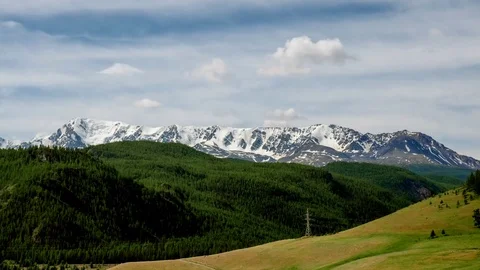 Fast floating clouds over the mountain. Stock Footage 77137371