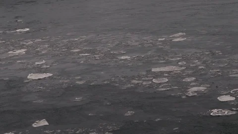 Fast Floating Cracking Ice Flowing on the Missouri River Stock Footage 103346230