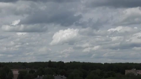 Fast-floating gray rain clouds over a green forest.  Time lapse video 動画素材 131440440