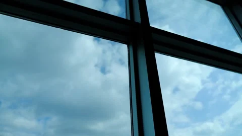 Fast flow of clouds in the sky outside from the office window Stock Footage 270150832