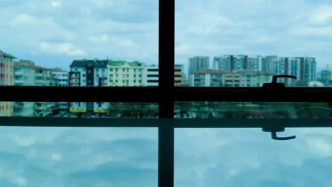 Fast flow of clouds in the sky outside from the office window 動画素材 270151607