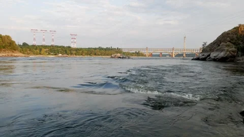 Fast flow of water of a wide river among rocks and rapids Stock Footage 255892643