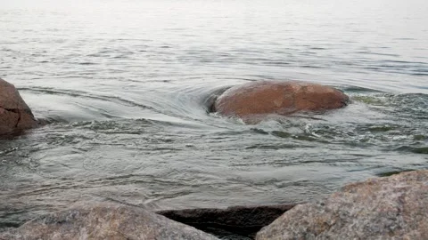 The fast flow of water of a wide river among rapids and stones Stock Footage 255893031