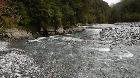 Fast flowing, clear mountain river running over clean stones, New Zealand. Stock Footage 146286766