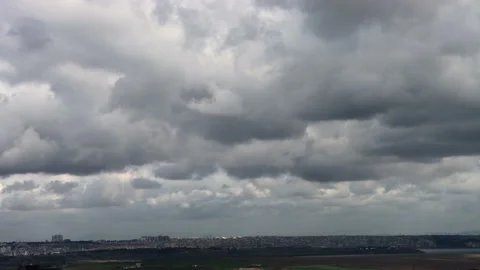 Fast flowing clouds, action nature scene. Time lapse of clouds over city Stock Footage 151422774