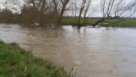 A fast flowing flooded stream after heavy rainfall 動画素材 122207728