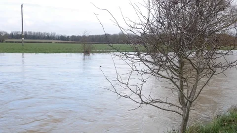 A fast flowing flooded stream after heavy rainfall Stock Footage 122207822