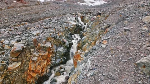Fast-flowing glacier-fed stream on the Glacier Basin Trail in Mount Rainier Nati Stock Footage 332141890