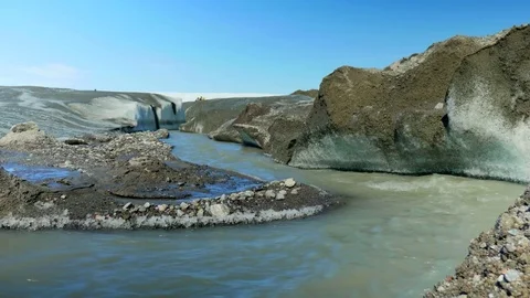 Fast Flowing Ice River through Melting Glacier Stock Footage 74870579