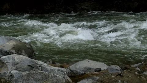 Fast flowing mountain river water Stock Footage 297715974