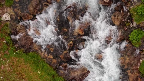 Fast flowing mountain stream aerial view Stock Footage 345711157