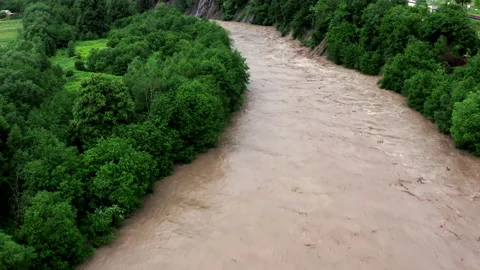 Fast flowing raging river after strong rain. Aerial flight above dirty mountain Stock Footage 152419276