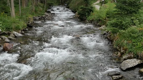 Fast flowing river downstream from the Riesachfall or Riesach waterfall Stock Footage 114457880