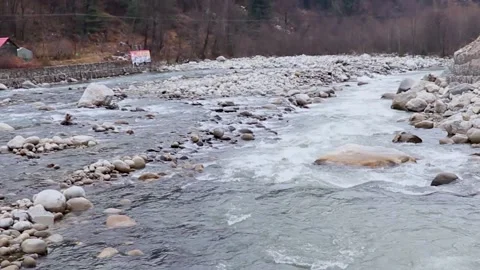 Fast flowing river having rocks in it. 库存影片 148254351