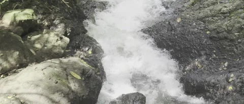 The fast-flowing river over ancient rocks Видео 296737039