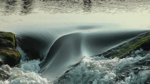 Fast flowing river over weir - ZoomOut Stock-Footage 35832645