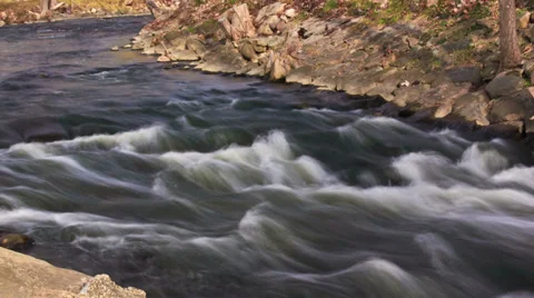 Fast flowing river rapids - 4K Ultra HD time lapsed Video stock 36722208