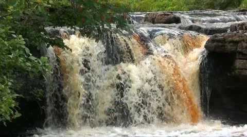 Fast flowing river with waterfall Stock Footage 12134200