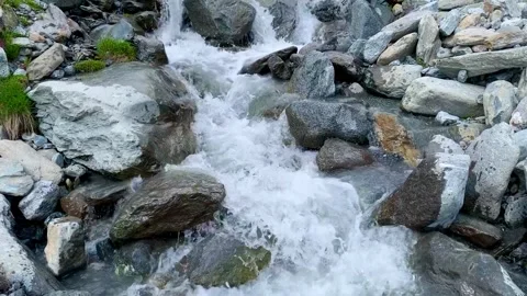 Fast flowing spring water in the mountain rocks Stock Footage 160834366