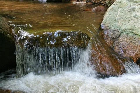  fast flowing water and rocks Stock Photos