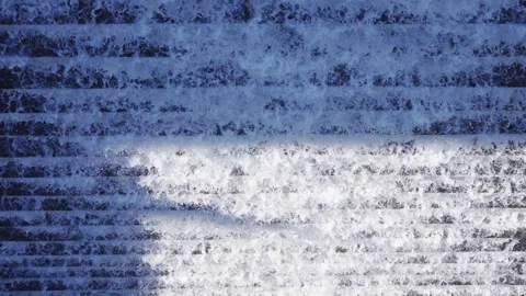 Fast flowing water cascading down stone steps in a natural landscape Stock-Footage 342325961