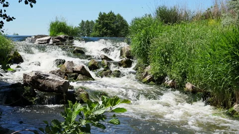 Fast flowing water in the mountain river, water spray from the waves. Texture of Stock Footage 198333602