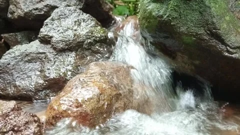 Fast Flowing Water Over Rocks with Strong Natural Movement Stock Footage 331728758