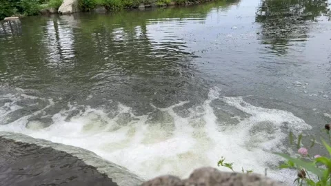 Fast Flowing Water Over Small Weir with Turbulent Current at Far Vídeos de archivo 341573682