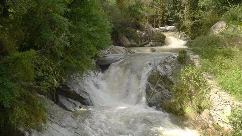 Fast Flowing Waterfall and River Stream Cascading Over Rocks in Forest 스톡 동영상 340453808