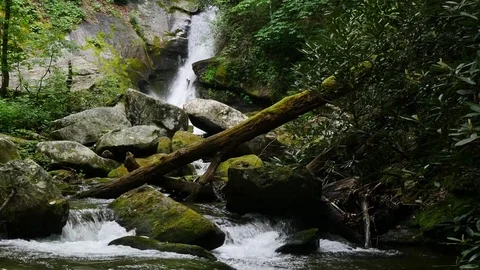 Fast flowing waterfall pound the rocks Stock Footage 75935238