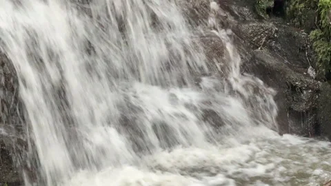 Fast flowing waterfall running down a stream in winter Vidéo 327156303