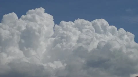 Fast fluffy white clouds bubbling on blue sky Stock Footage 159075747