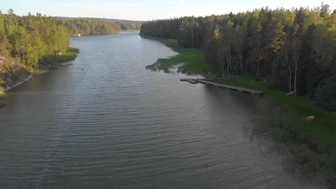 Fast fly above the river low altitude in Finland Stock Footage 110839447