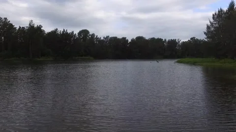 Fast Flyby Shot of Wide River on an Overcast Day Video stock 58633334