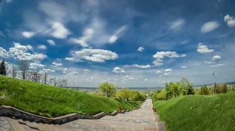 Fast flying clouds above the city, Timelapse Stock Footage 50258719