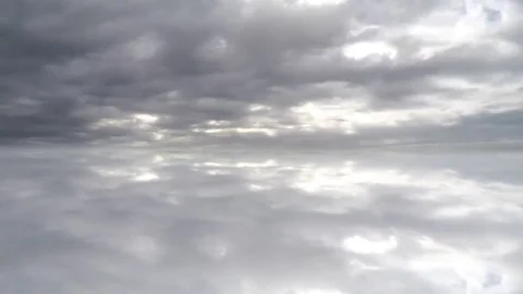 Fast flying clouds. Reflected clouds Stock Footage 74932129