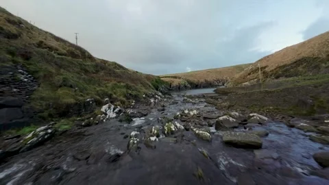 Fast Flying Fpv Drone View Rocky River Flow In Ireland surrounded by mountain Stock-Footage 262974430