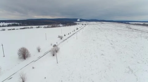 Fast flying over snow-covered roads, fields toward the horizon 스톡 동영상 58539171
