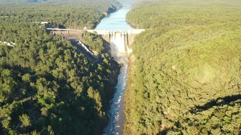 Fast flying over Warragamba river to Sydney Water dam leaking rain water. Stock Footage 189855337