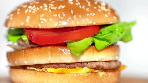Fast food, Beef burger rotating 360 loop on the black plate on black background Stock Footage 336578667