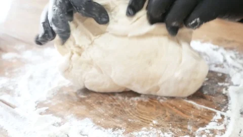 Fast food chef hands in gloves rolls out filo puff dough cuts roll, tart or cake Stock Footage 119524059