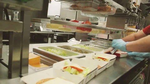 Fast food how to make a hamburger in a restaurant kitchen Stock Footage
