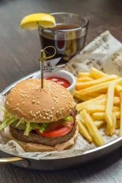Fast food menu with hamburger and glass of cola Stock Photos