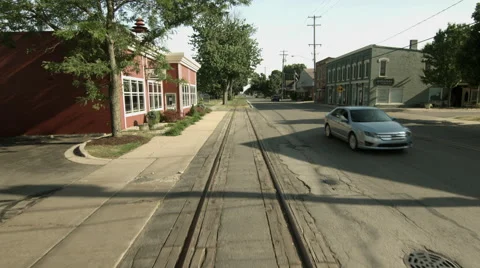 Fast forward along railway through town 4K Stock Footage 40133946