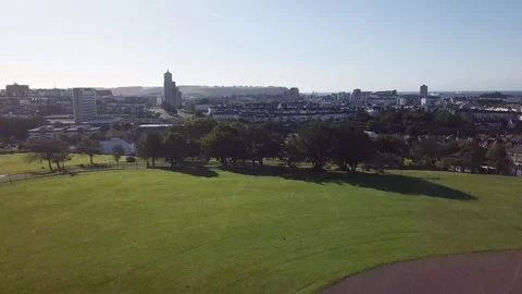 Fast Forward Drone Flyover of Baseball Field Toward Plymouth City Centre 4k Stock Footage 320946481