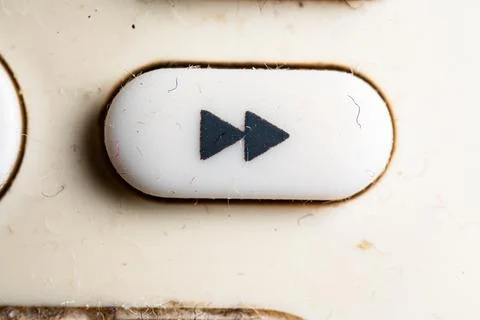 Fast forward icon and button close up of a old Television remote controller Stock Photos