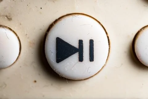 Fast forward icon and button close up of a old Television remote controller.. Stock Photos